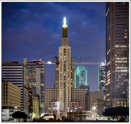 Mercantile Lofts illuminating the Dallas Skyline.