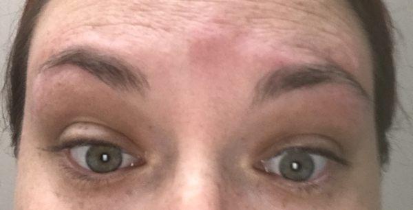 2 different shaped and sized eyebrows