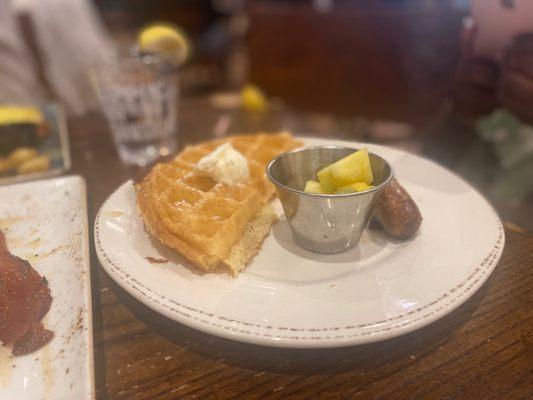 Kids' meal with a waffle and sausage