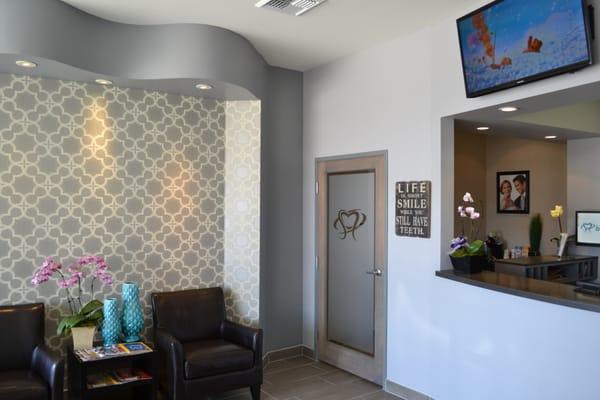 Reception area where patients check in and family members can wait during the appointment.