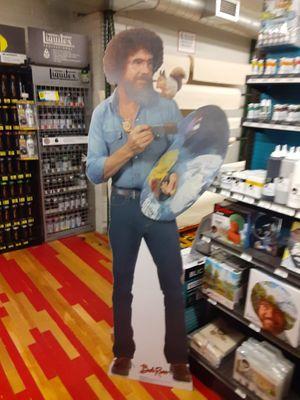 Beautiful Bob Ross cutout posing to paint beautiful happy trees.