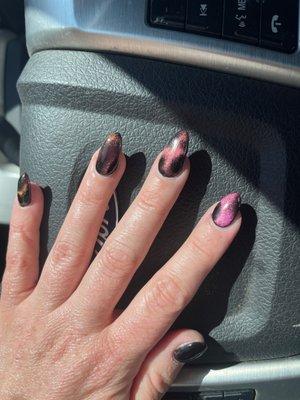 I got my thumb and index shorter so I could function.  Don't these nails look awesome!  Cat's eye!  . Thank you Mr. Bond!