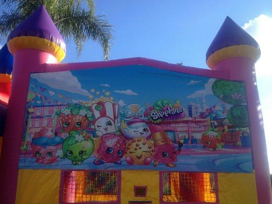 Bounce house with shopkins display.