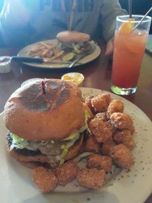 Veggie deluxe burger & tots with a sex on beach drink