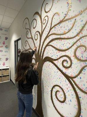 Stamping the wall as a welcoming into the Thurman Orthodontics family.