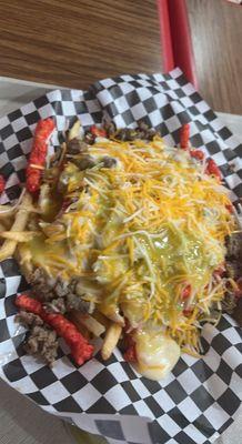 Hot Cheeto Fries with steak and green salsa