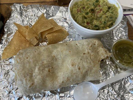 Breakfast burrito  Side order of guacamole. Slightly brown from over ripped, avocados, but still good.