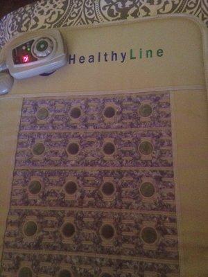 My Amethyst, Jade, and Tourmaline heated mat I use on my table to speed your healing process up!