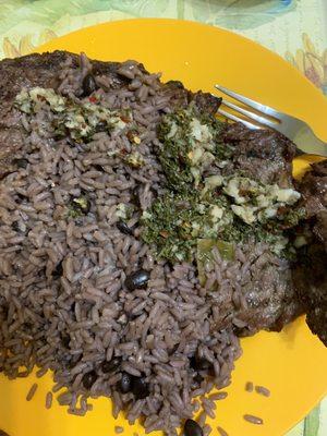 Churrasco with a spicy chimichurri and moros (black beans and rice)