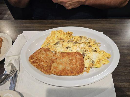 Lamb gyro and feta omelet with hash brown patties.