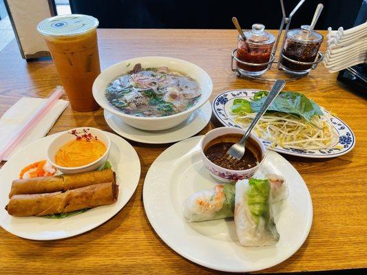 Spring rolls , egg rolls , combination meat pho and Thai tea