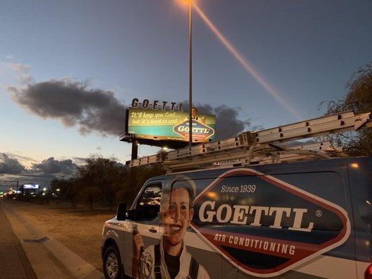 Goettl service van under Goettl billboard