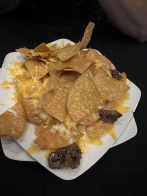 Cheesy nachos with prime filet add on and no peppers (corn was unintentionally left off)