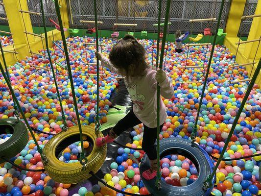 Different challenged activities in the ball pit area.