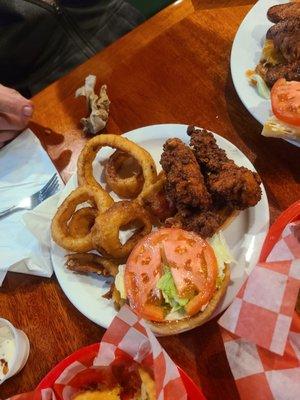 Hot chicken sandwich and onion rings