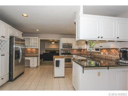 This amazing Kitchen features updated Stainless 5-burner gas range, microwave, sink/faucet and dishwasher...