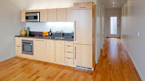 Kitchen with light wood finishes.