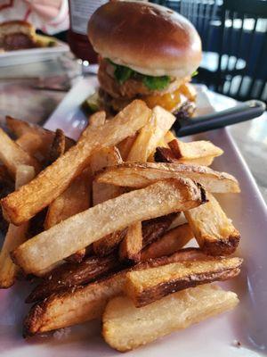 Signature burger with fries.