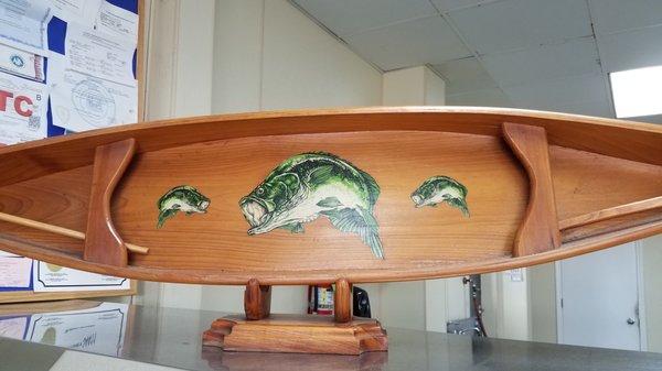 Nifty little bass fish-canoe on top of the display case. Ask John - there's a cool story that goes with this!