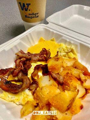 Scrambled Eggs with American Cheese, Bacon, Potatoes & Coffee.