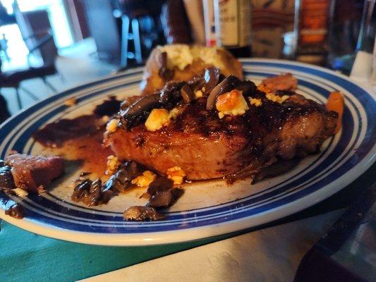 Horseradish and blue cheese encrusted New York Strip, baked potato, and seasoned carrots.