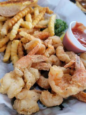 Fried shrimp basket with fries, coleslaw and garlic bread.