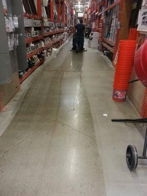 He is cleaning the floors with a nifty machine.  :-)