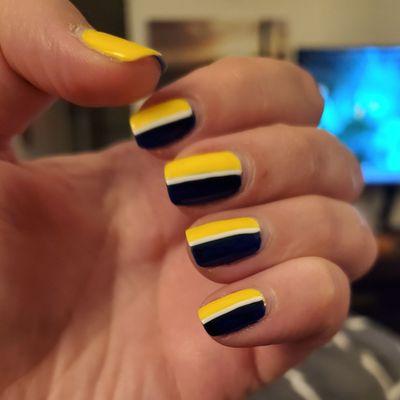 My navy and yellow nails with a white accent stripe.