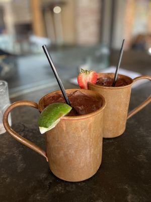 Regular Moscow Mule and Strawberry Mule. Deep mugs, ice cold, and soo delicious and refreshing!!