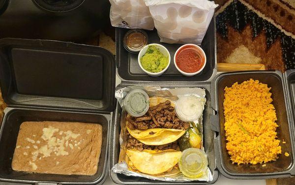 Steak and chicken tacos, beans & rice