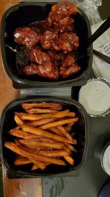 Boneless chipotle BBQ chicken wings and sweet potato fries with extra ranch