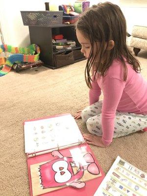 Staying focused during her home based WordPlay speech-language therapy session.