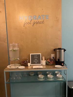 Hydration station with tea and water at Squeeze Massage Alamo Heights