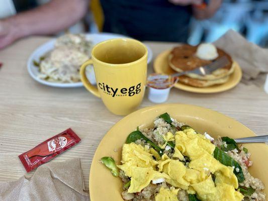 Quinoa bowl, big city, breakfast, and a stack of blueberry pancakes. The dark roast coffee is solid.