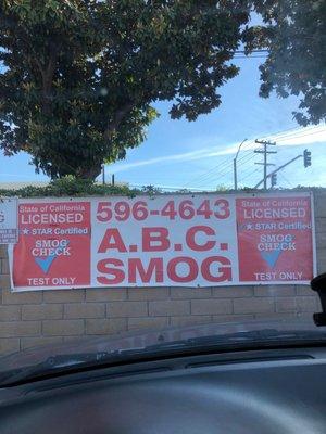 Banner of ABC Smog and phone number.