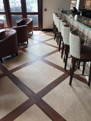 Travertine floor with wood inlay before polishing