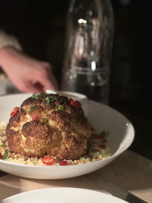 Whole roasted cauliflower with cous cous and tahini/turmeric