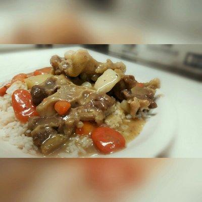 Ox Tails with gravy over whit rice