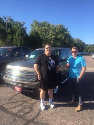 Happy customer and I with his 2013 Chevrolet Silverado he purchased!