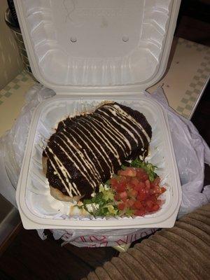 Chicken Burrito topped with Mole