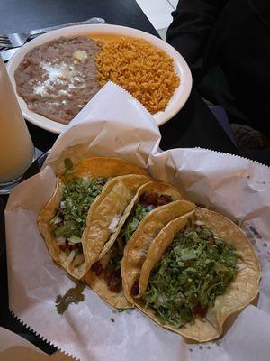 Al Pastor (marinated pork) tacos with rice and beans