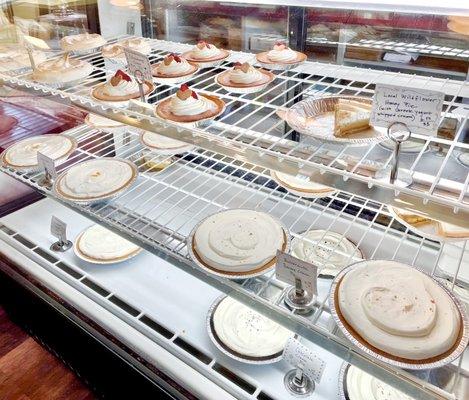 Pies on display: lemon meringue, strawberry cream, wildflower honey, key lime, butterscotch banana cream, coconut cream, chocolate cream