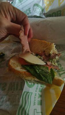 A beef sandwich. One slice of beef and one slice cheese. When did Subway get cheap on lettuce