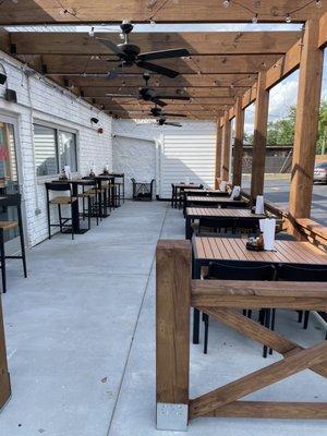 Patio gets perfect afternoon shade; comfy chairs, love the ceiling fans