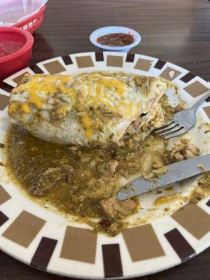 A Chile Verde WET burrito. With chicken beans and cheese.