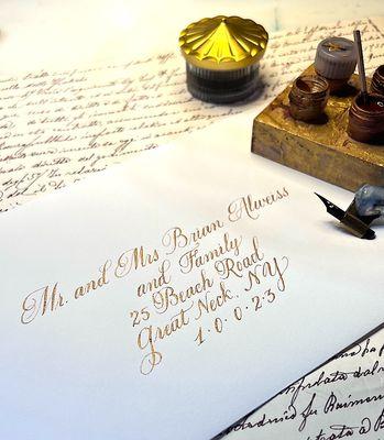 Envelope addressing- Copperplate script, gold ink. The classic ...you can't go wrong with classic.