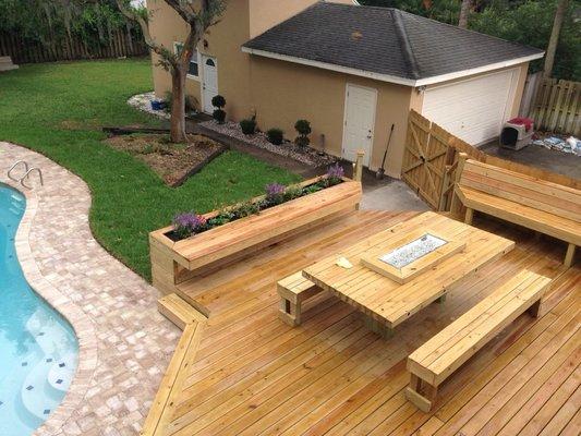 Patio deck and built in fire table and fence replacement and sod replacement and tree trimming and integrated planter boxes