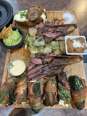 The experience - arrachera, sirloin, poppers, beans, guacamole, and papa