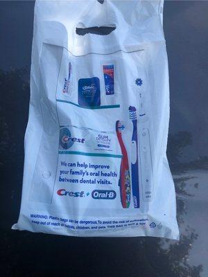 Dentist bag with toothbrush floss toothpaste for patients