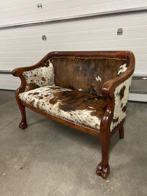 Took this antique settee to another level with hair on hide!